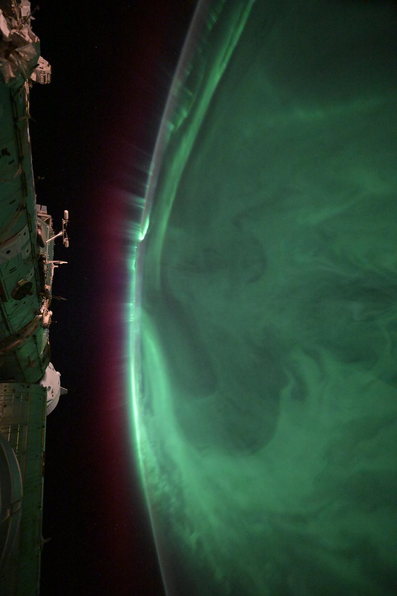 Green auroras stretching as far as the eye can see, almost mistakable for another planet rather than the blue Earth we call home.