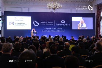 First image shows a man in traditional Saudi attire including red and white checkered headscarf and robe standing at a podium with microphone and papers, speaking in front of a blue backdrop featuring the Maaden logo and text Minerals of the Future Saudi Vision 2030, contact number 199001 visible below. Second image depicts an elegant hall with chandelier and large screen displaying opening remarks by Dr. Khaled Al-Falih, Ministry of Industry and Mineral Resources logo, Maaden logo, and live feed of a woman in abaya speaking, audience seated in formal wear. Third image captures four men in business suits and traditional attire posing together near a display screen showing Future Forum logos and participant photos, flowers on a table, and Maaden emblem. Fourth image illustrates a luxurious venue with red carpet, ornate ceilings, and multiple display booths including Maaden, showcasing professionals in suits and dresses networking and viewing screens with event branding.