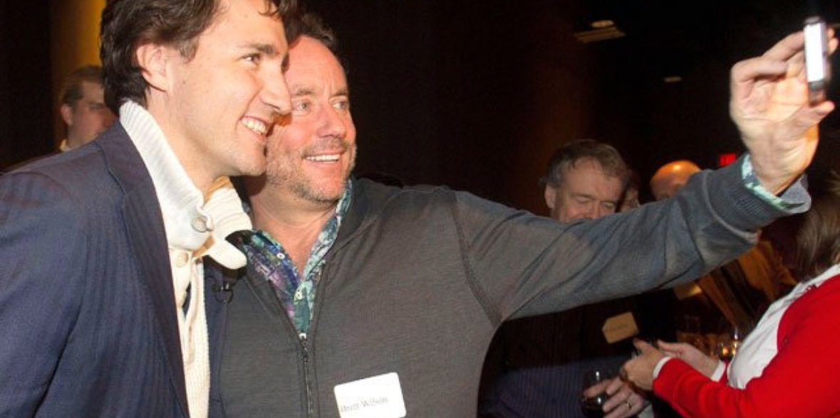 CPCStaffer's tweet image. Brett Wilson taking a selfie with his boyfriend.