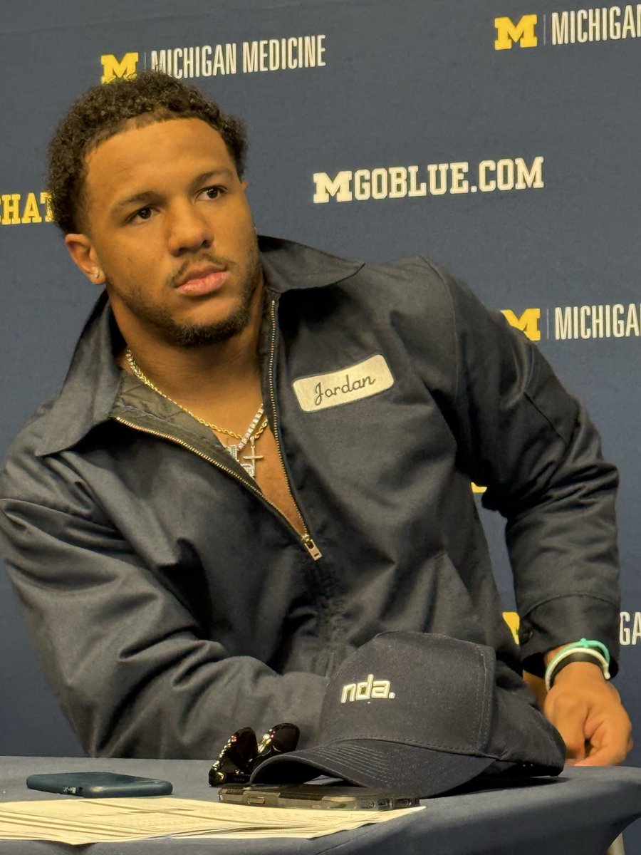 Jordan Marshall is wearing his blue collar jacket.