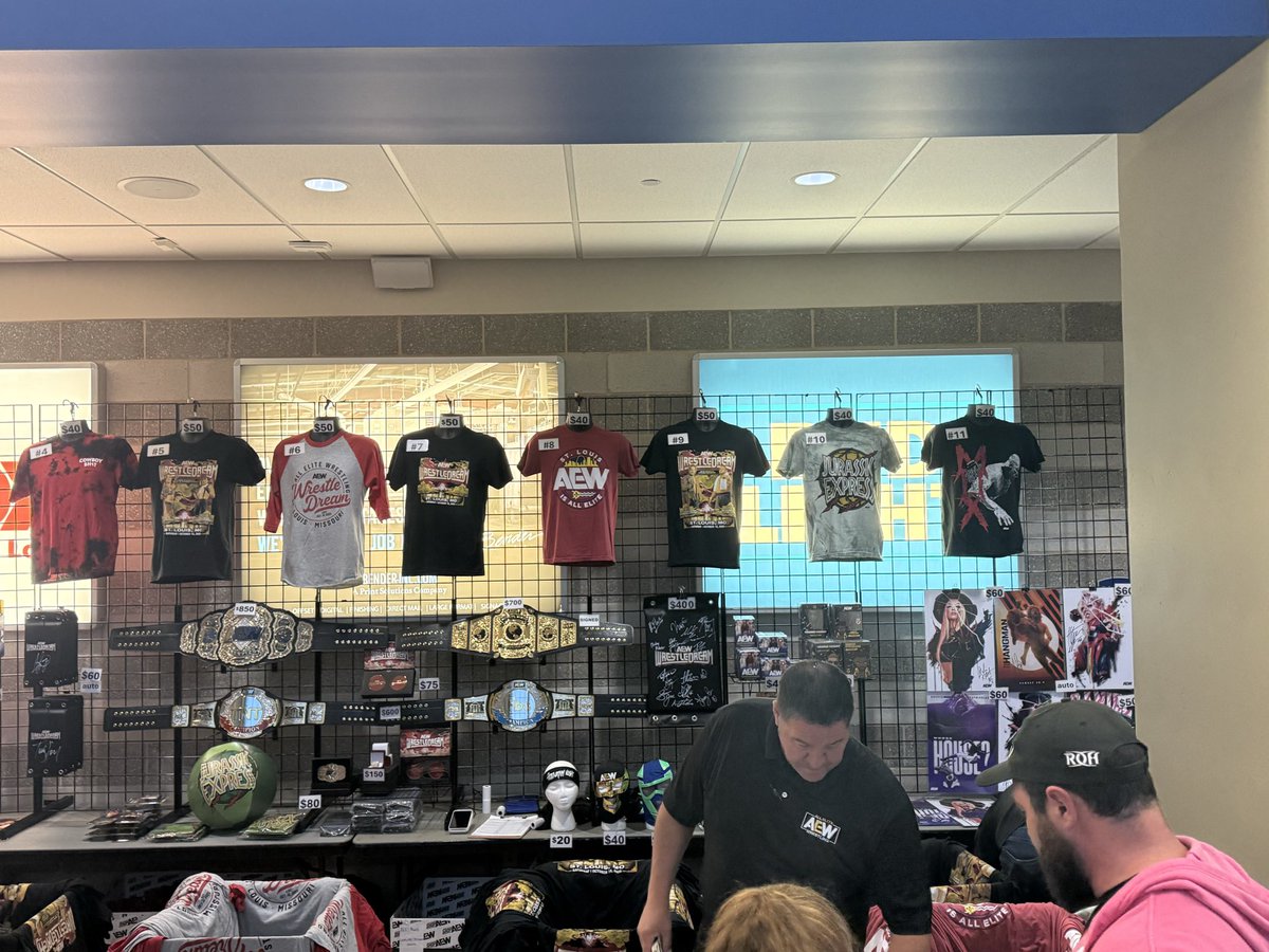 bstrassburg's tweet photo. The #AEWWrestleDream merch area. #MerchFreak https://t.co/BxSwC5r9Dq