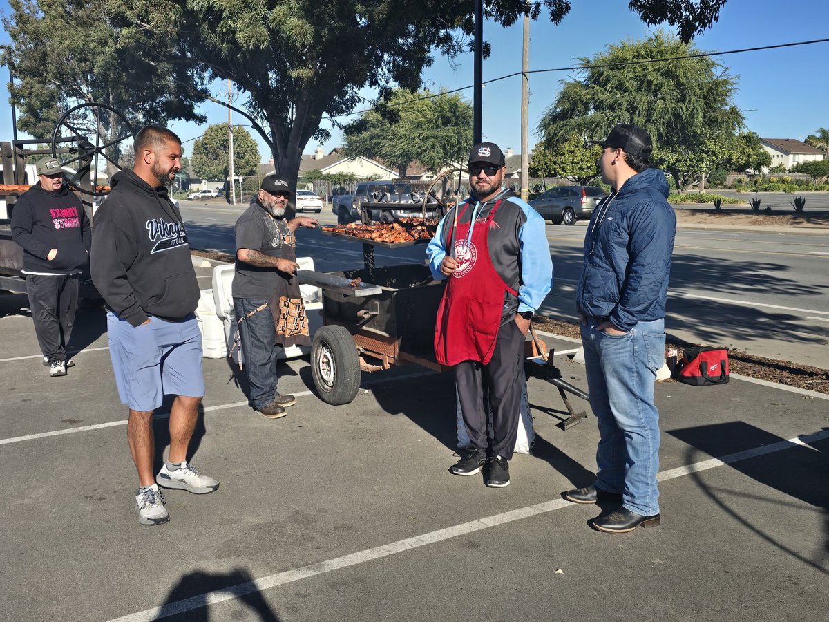 nshssports's tweet image. NSHS BBQ fundraiser. Football coaches putting in series work.