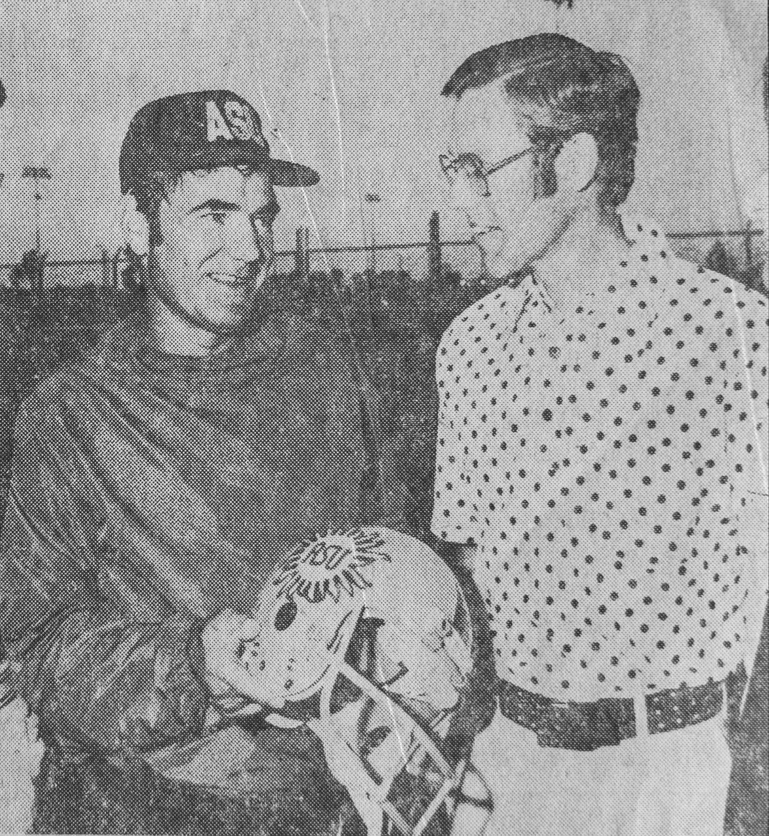 bschlenker's tweet image. 1975 That’s my dad on the right seeing his design on the helmet for the first time and meeting Coach Kush.