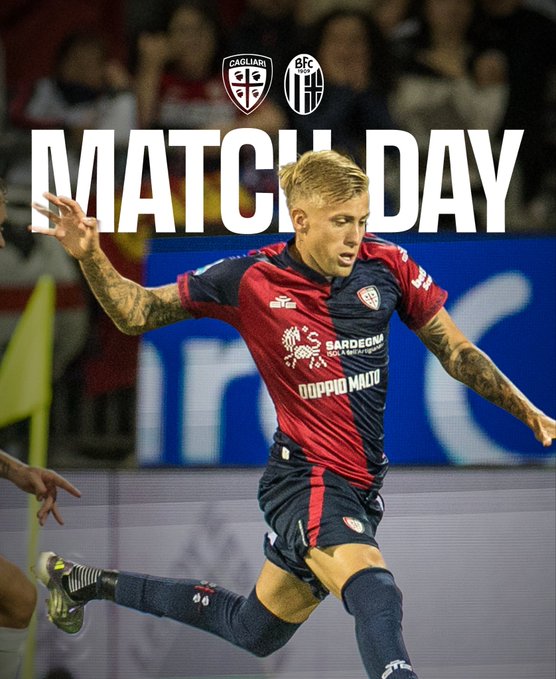 A soccer player with blonde hair and tattoos on his arms runs dynamically while wearing a red and blue Cagliari jersey with the team crest on the chest, shorts, and socks, against a stadium background with blurred spectators and the Bologna team crest visible in the upper left corner, overlaid with bold white text MATCH DAY.
