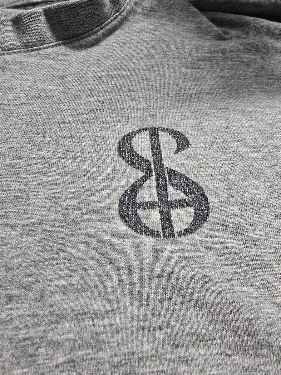 Standing here in front of the dryer, realizing that the Sacred tee and I have grown old and washed together. Truly poetic