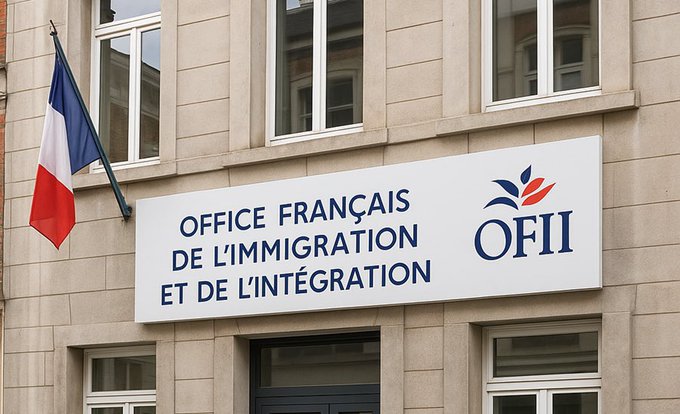 A beige stone building facade with multiple rectangular windows on upper floors, a dark entrance door at ground level, and a French flag hanging from a pole on the right side. A white signboard mounted below the windows displays blue text reading OFFICE FRANÇAIS DE L'IMMIGRATION ET DE L'INTÉGRATION above a logo with a stylized flame-like emblem in blue and red, and the acronym OFII in large blue letters below.