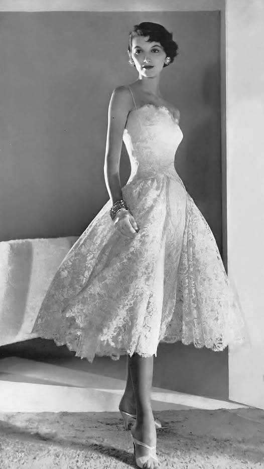 Joan Romano wears a white lace dress, the top is fitted at the hip.  An Estevez creation for Grenelle, from Stern &amp; Stern lace. Satin sandals, Julianelli. 
Horst P. Horst
US Vogue March 15, 1955
The Fashion Spot, Chic in Silk
Thanks to Fashion of Bygone Days for sharing.