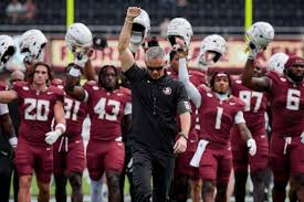 Looks like a pic of Norvell leading the players straight to the transfer portal.  I'm still a loyal (but weary) Noles fan with head in hands watching these games. Such high hopes after game 1- What happened??! #FSU #Seminoles