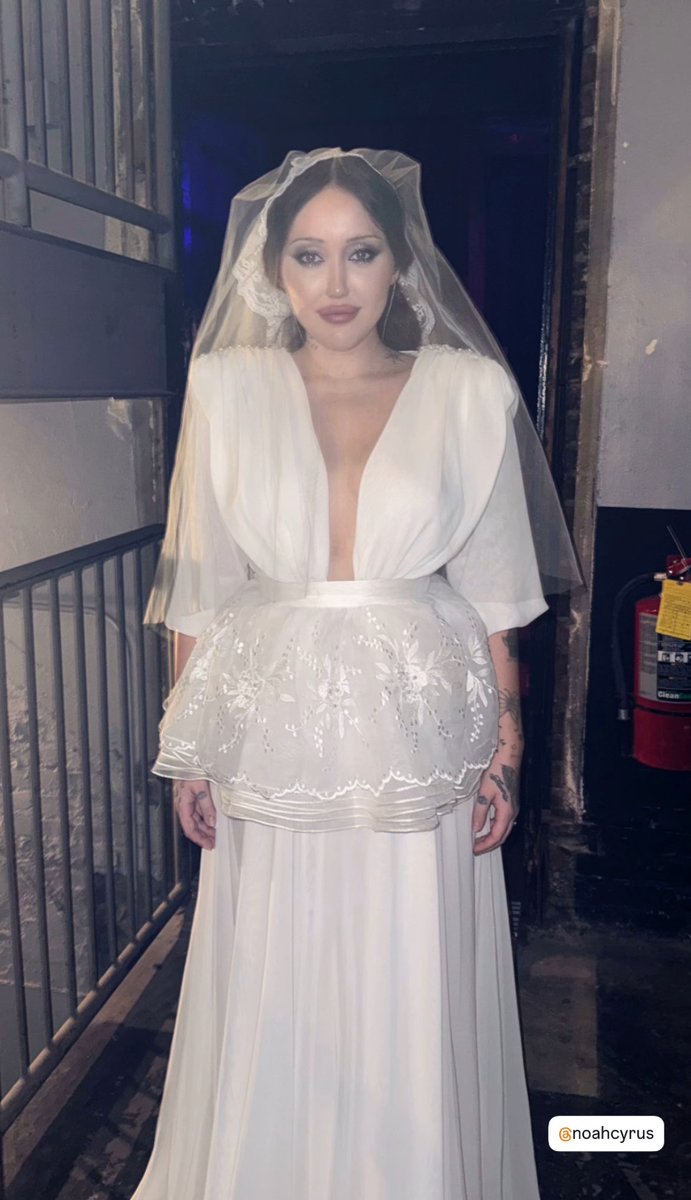 Noah Cyrus stuns in bride look for her concert in Atlanta. Noah Cyrus stuns in bride look for her concert in Atlanta.