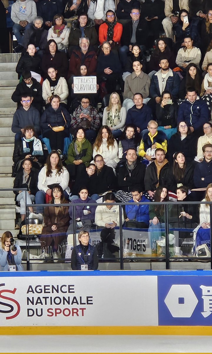 She held her sign up the whole time, from FB/C skating in to results #GPFIGURE #GPFRA "TRUST SURVIVOR"