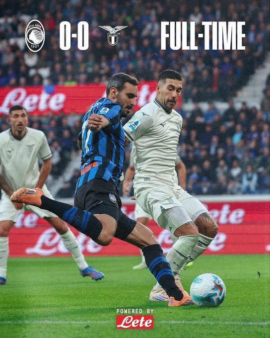 Full-time score overlay shows 0-0 between Atalanta and Lazio on a soccer field. Players in blue-and-black striped jerseys and white jerseys compete for the ball near the goal line. One player in blue-and-black kicks the ball while another in white challenges. Stadium crowd and red sponsor banners visible in background. Letete branding at bottom.