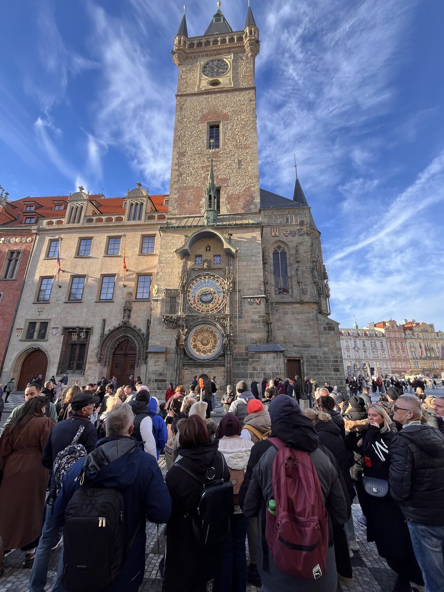 The crowds congregate around the medieval astronomical clock in the Old Town Square in Prague, as they do daily, it being one of the great wonders of this ancient and well preserved city.