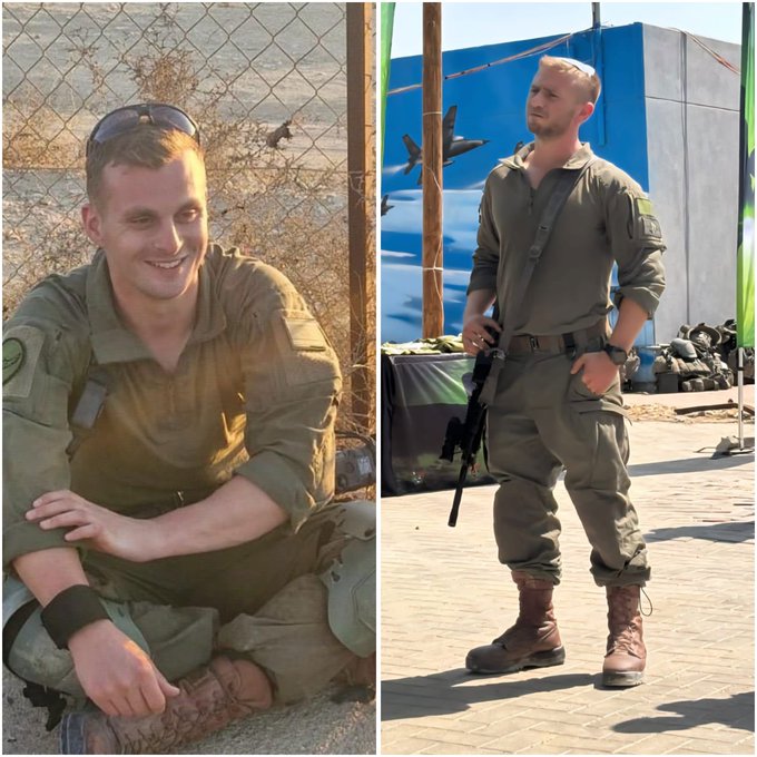 A split-image collage showing two photos of a young Israeli soldier with short blond hair: on the left, he is sitting relaxed on the ground in military uniform near a chain-link fence in a desert-like area with sparse vegetation; on the right, he stands formally in full combat gear, including a rifle slung over his shoulder, near a blue-painted structure adorned with Israeli flags, green palm motifs, and a mural of fighter jets, suggesting a military base or outpost.