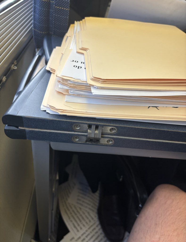 PeterTwinklage's tweet image. one of the more bizarre violations of the social contract i’ve ever seen. the man sitting across from me has a few hundred printed articles from The Wall Street Journal. every time he finishes one, he rips it in half and shoves it in the gap between his seat and wall of the train