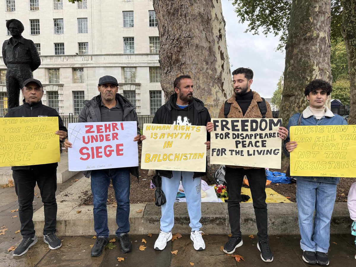 BalochV4Justice's tweet photo. Members of the Baloch diaspora in the United Kingdom staged a protest outside 10 Downing Street in London against what they described as a “brutal military operation” in the Zehri area of Balochistan.

The demonstrators carried banners and chanted slogans accusing Pakistani security forces of human rights violations. They called on the British government to “break its silence” and hold Pakistan accountable for what they termed ongoing abuses in Balochistan.

According to the organizers, ordinary residents of Zehri are facing a “siege-like situation,” with intensified military operations in the area. They alleged that women and children are being killed in bombings, roads have been blocked, and curfews imposed—leaving the local population in a state of extreme distress. They described the situation as “a systematic genocide” and urged international human rights organizations to send fact-finding missions to the region.

#ZehriUnderSiege
#StopBalochGenocide