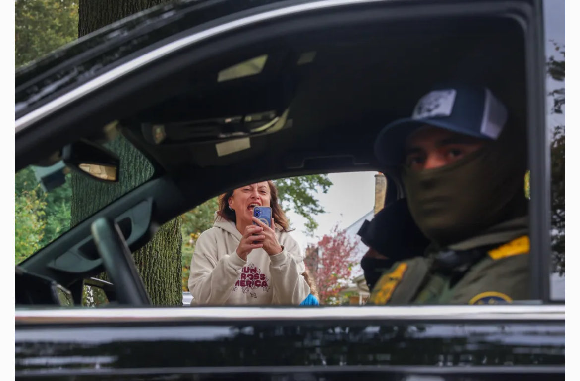 Mount Prospect resident Lisa Porter screams at federal agents and tells them to leave as they sit in their SUV along East Busse Avenue. <a href="/WescottImages/">Stacey Wescott</a> is an amazing photographer <a href="/chicagotribune/">Chicago Tribune</a>