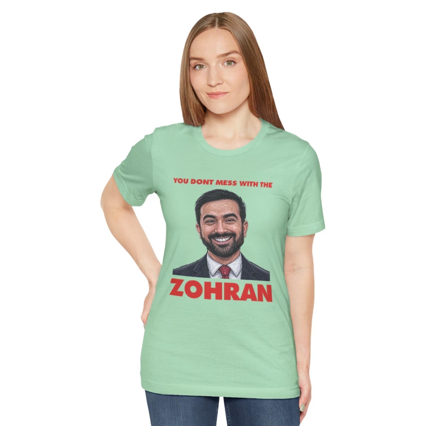 Zohran Parody Graphic Tee: Funny Political Humor Shirt by SMBIndustries

etsy.me/47z0nug

Funny parody T-Shirt featuring a mix of Zohran Mamdani and You Dont Mess With The Zohan. Perfect for those who enjoy humor, political and pop culture references. Ideal for casual