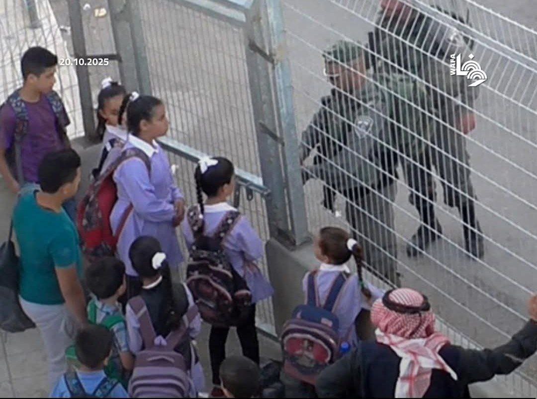 Israeli occupation forces block students and teachers from reaching their school in Hebron, south of the occupied West Bank, today.