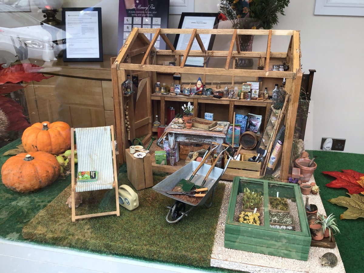 The autumn display in Rowland Brothers window includes this small but very detailed model of a garden shed.