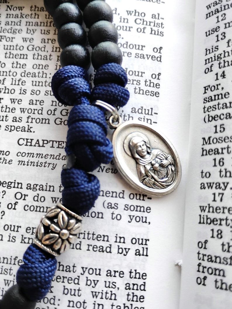 ✨It's giveaway time!✨

This rosary is made with black wooden beads, an Immaculate Heart of Mary medal, a pardon crucifix and navy blue paracord.

To enter for a chance to win this rosary:

1) Like this post
2) Leave a comment below
3) Follow <a href="/StarOtheSeaGift/">Star of the Sea Catholic Gifts LLC</a> (if you're not