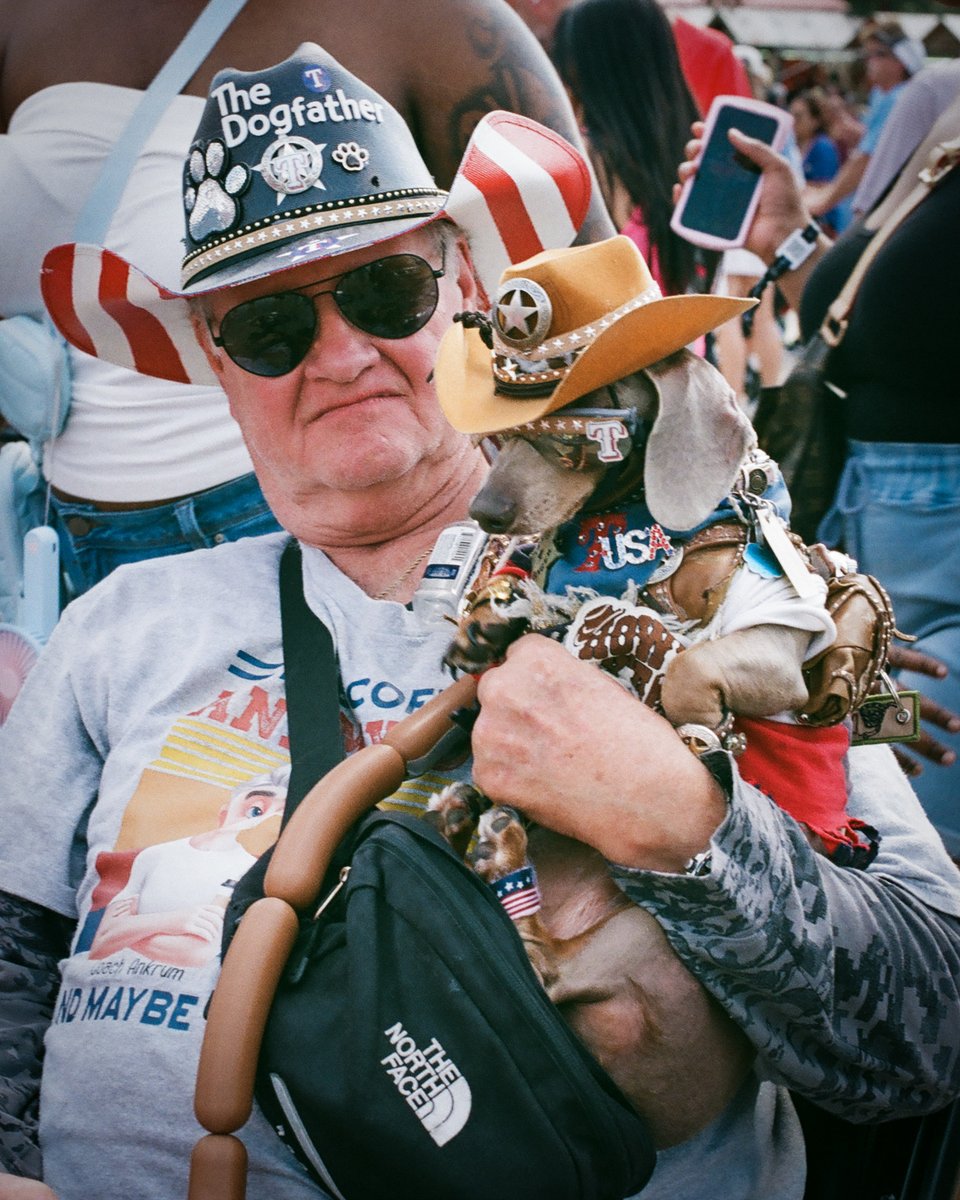 Somewhere at the Great <a href="/StateFairOfTX/">State Fair of Texas</a> with The Dogfather and my Nikon F6 camera. If I could sum up the fair in one photo, this would be it.

#filmphotography #filmtography #filmcamera #streetphotography #notstreetphotography #dog #cowboy #statefairoftexas #TheNorthFace