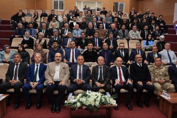 First image shows a man in suit speaking at podium with microphone in conference hall screen displays Turkiye Yuzyili Maarif Modeli and Hayat Boyu Ogrenme logos banners with Bingol University emblem and Turkish flags visible. Second image depicts large group of men and women in formal attire seated in auditorium rows some wearing headscarves table with white flowers and water glasses in front. Third image features diverse group of young women and men standing on stage in casual and formal clothes behind screen showing Ale Konferanslari Bingol logo. Fourth image portrays two men in suits one presenting plaque to the other on wooden floor against dark background with screen showing emblem.