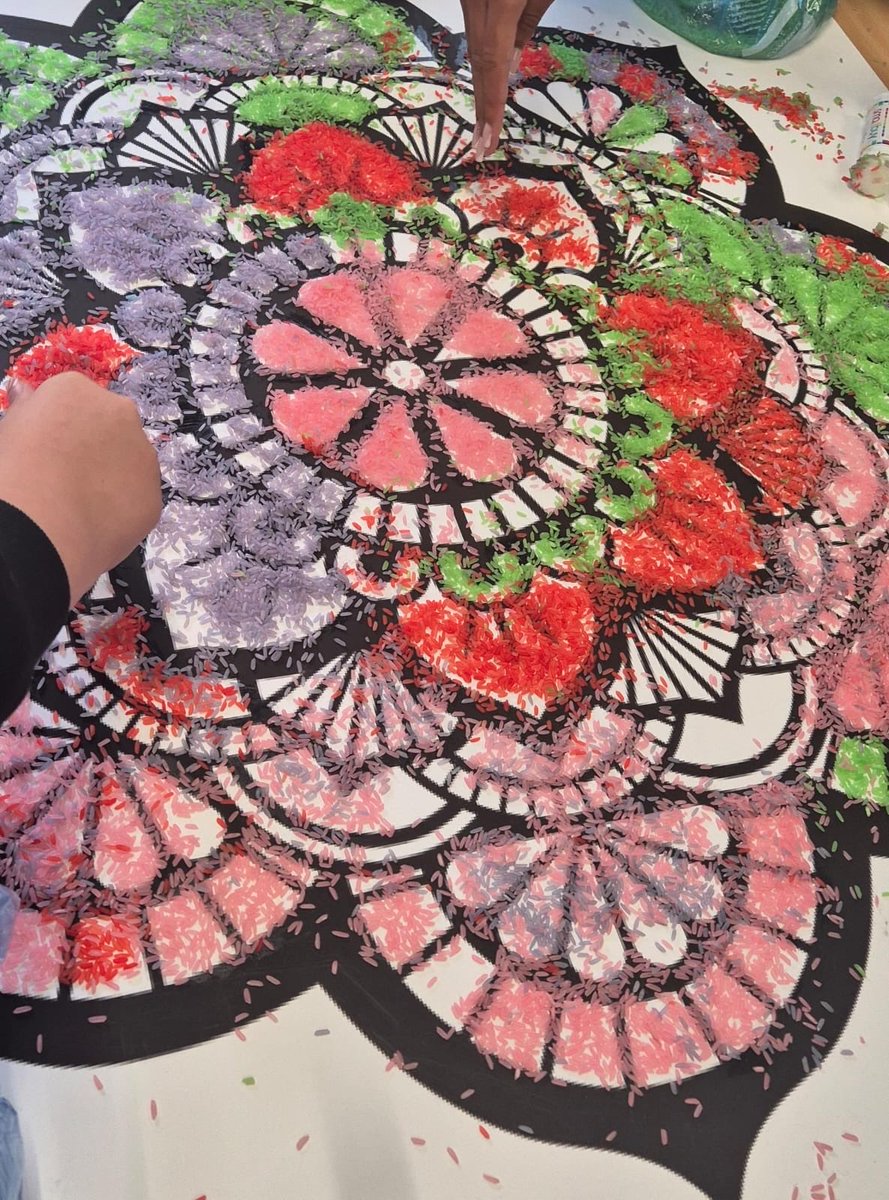 BournvilleSch's tweet photo. To celebrate #Diwali2025 students have worked together to create an enormous Rangoli using coloured rice! Fantastic work! #respectandtolerance #tradition https://t.co/0lvmv1S6bK