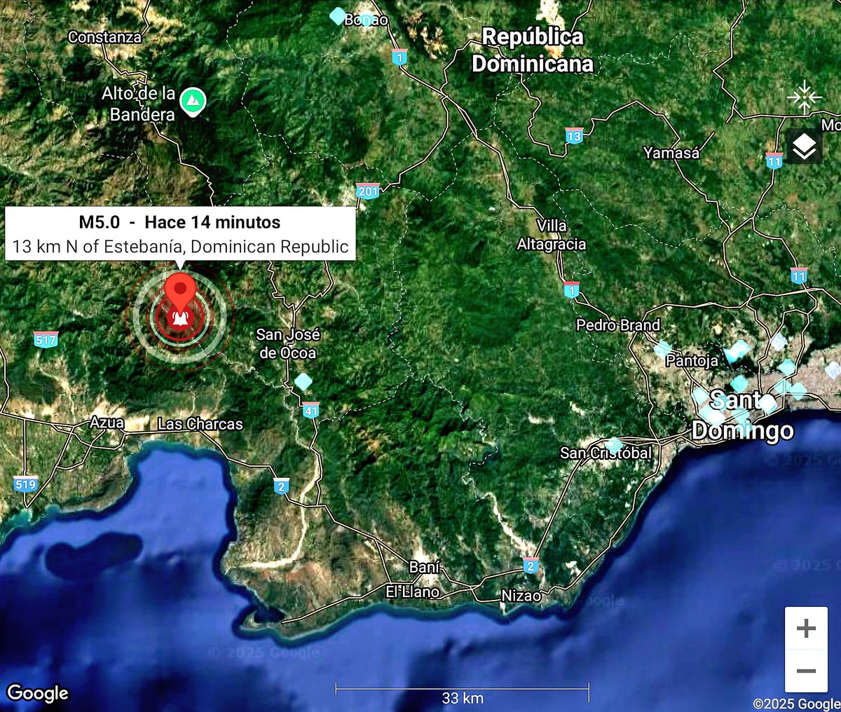 Geographic map of the Dominican Republic highlighting an earthquake epicenter marked by a red icon 13 km north of Estancia approximately 14 minutes ago with labels for locations including San José de Ocoa Azua Las Charcas and surrounding areas like Santo Domingo and the border with Haiti featuring Google Maps interface elements and a scale bar
