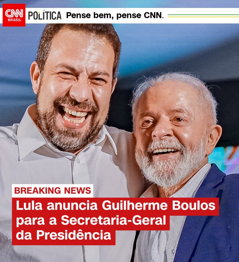 Two older men smiling and standing close together one with a beard wearing a white shirt and the other with gray hair and beard in a blue suit against a blue background with CNN Brasil logo and Portuguese text reading Breaking News Lula announces Guilherme Boulos for the General Secretariat of the Presidency.