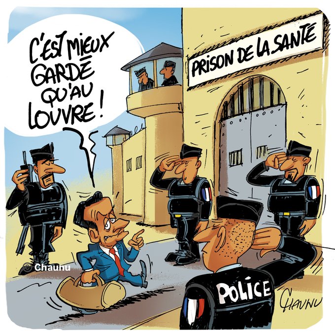 Cartoon illustration shows a bald man in a suit and tie, identified as Nicolas Sarkozy, walking toward large prison gates with a brown suitcase in hand, pointing forward with an exaggerated grin. Several uniformed police officers stand saluting nearby, one holding a walkie-talkie. Prison towers with guards overlook the scene, and a sign reads Prison de la Santé. Speech bubbles above include French text Cest mieux garde go au Louvre. The artwork is signed Chaunu at the bottom right.