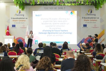 First image shows two side-by-side photos of men in suits speaking at podiums with eTwinning banners Turkish and EU flags and floral decorations in a conference room. Second image depicts a large group of diverse attendees mostly women in professional attire seated at red-covered tables in a spacious venue with blue eTwinning banner hanging plants and a stage. Third image captures an audience raising hands in applause during a presentation with eTwinning logos on screens Turkish flag and colorful banners in a hall with seated participants. Fourth image features a woman presenting at a podium with eTwinning and Together We Shine banners Turkish and EU flags projector screen showing text and attendees seated at tables in a decorated room.