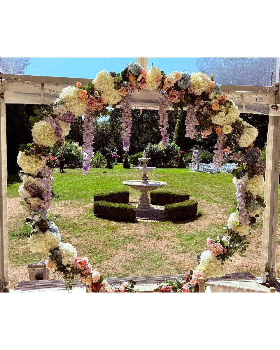 Soft pastels and elegant silk flowers by Fancy Faux created the perfect romantic setting for this gorgeous outdoor ceremony. #huttonhall #exclusivevenue #essexbrides #essexweddingvenue
