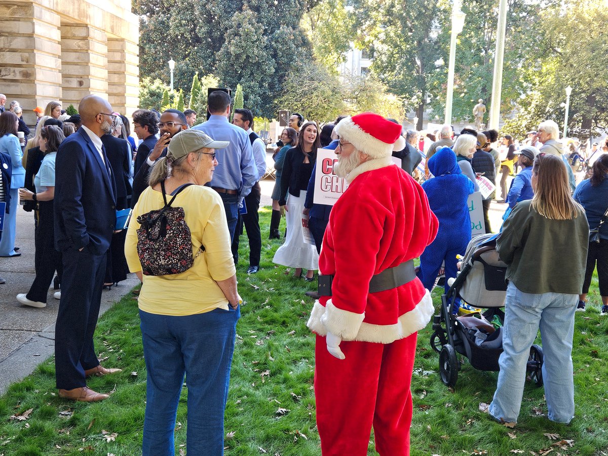 Rally to protest newly gerrymandered Congressional maps is about to start outside the Capitol Building. Santa Claus is here #ncpol #ncga
