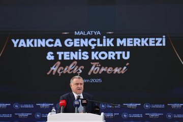 First image shows a man in a suit speaking at a podium during the opening ceremony with a large screen displaying Turkish text Yakınca Gençlik Merkezi and Tenis Kortu Açılış Töreni in Malatya along with microphones and banners. Second image depicts the same man in a suit holding a ribbon with children including boys and girls some wearing headscarves and casual clothes surrounded by adults in formal attire cutting the ribbon in front of a stage. Third image captures a group of young basketball players in green jerseys and others in casual clothes with adults including suited officials jumping to shoot a basketball into a hoop inside a gymnasium with Turkish flags and banners on the walls. Fourth image features a large group photo of children in sports jerseys holding basketballs adults in suits and formal wear posing together in a hall with wooden paneling red curtains a basketball hoop and Turkish flags in the background.