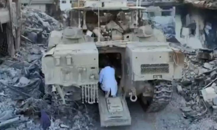 DR HUSSAM ABU SAFIYA trying to negotiate with Israel Occupying Forces outside Kamal Adwan Hospital to allow him to keep operations at the hospital on as he was attending to patients who were in critical circumstances and could not be safely moved in Gaza's war conditions. This