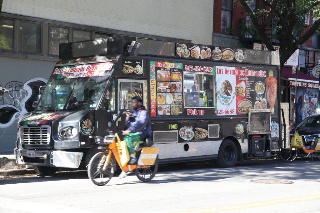 Magangni, eggplant-and-okra stew loaded with lamb, from 2M Guinea Food. Hefty, especially the rice, for my $12. The truck, still wearing some old Mexican signage, parks on Ave. A just above Tompkins Square Park, near a bike-delivery hub that seems to supply most of its customers.