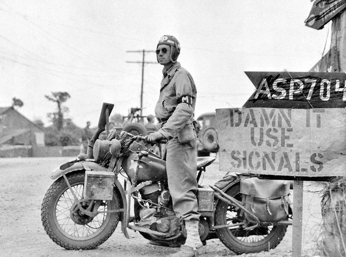 An American MP on a Harley Davidson. WW2, Saint-Lô, France, 1944.