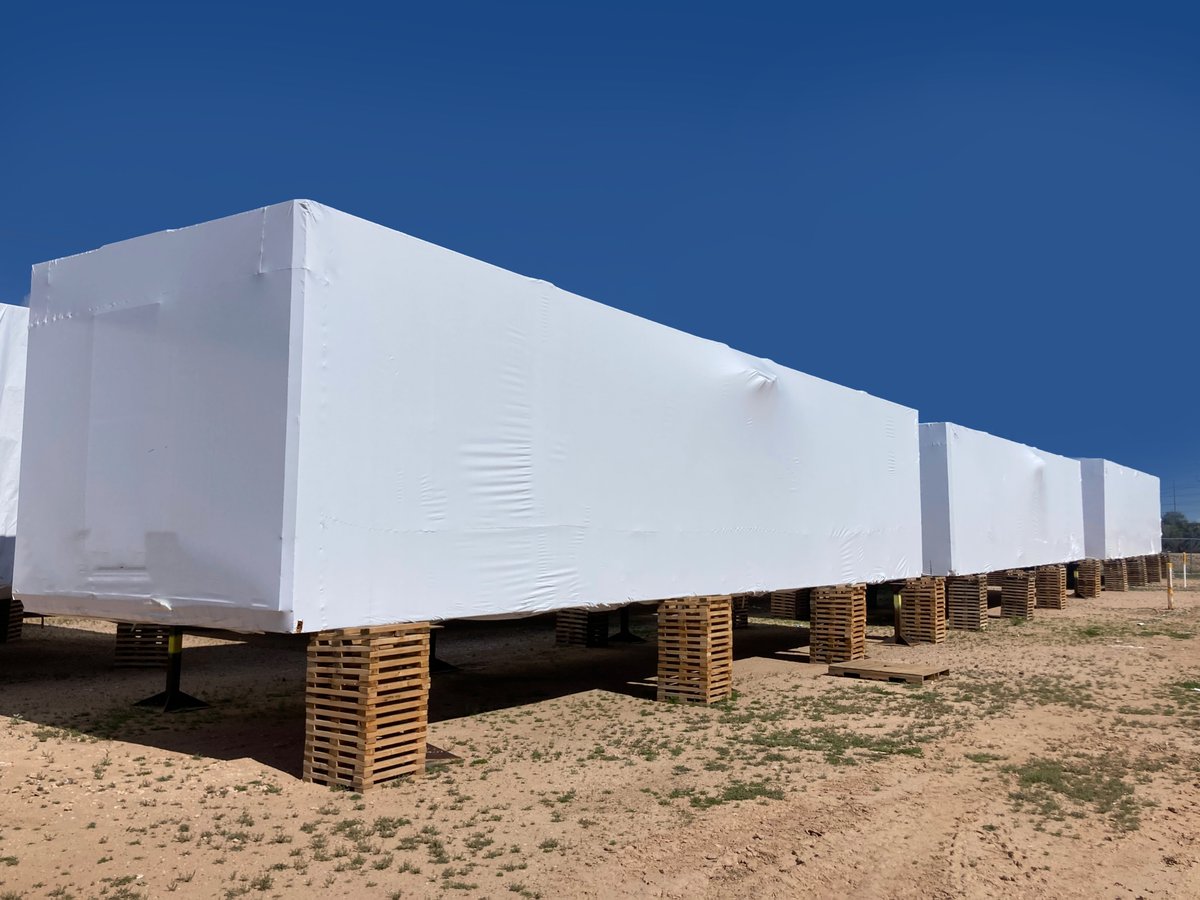 transhield's tweet image. Desert sun, dust, and temperature swings...Still factory fresh. Our custom-fit covers keep these modular units sealed, UV-resistant, and ready for install the moment they leave storage.

#factoryfresh #ModularConstruction #OffsiteConstruction