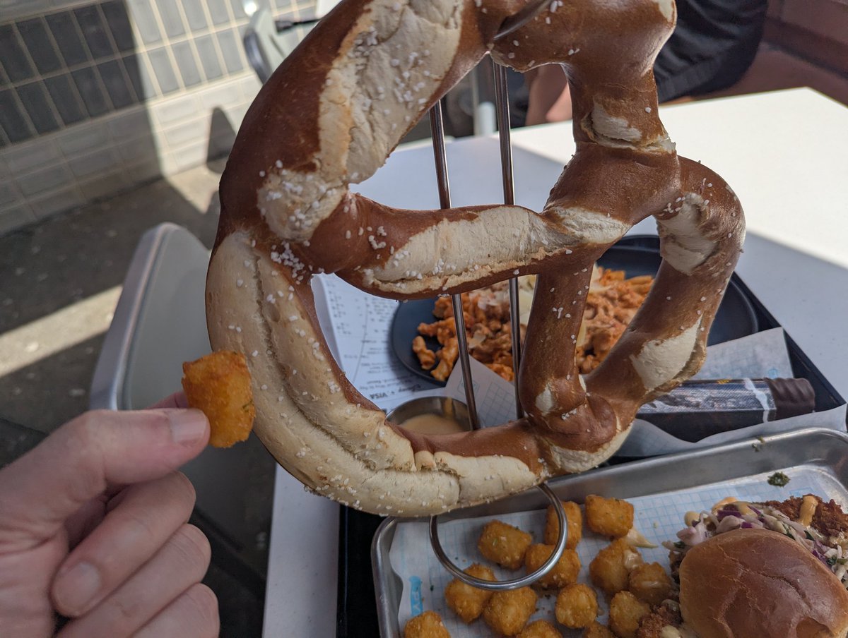 A perfectly reasonably sized pretzel with tater tot for scale.