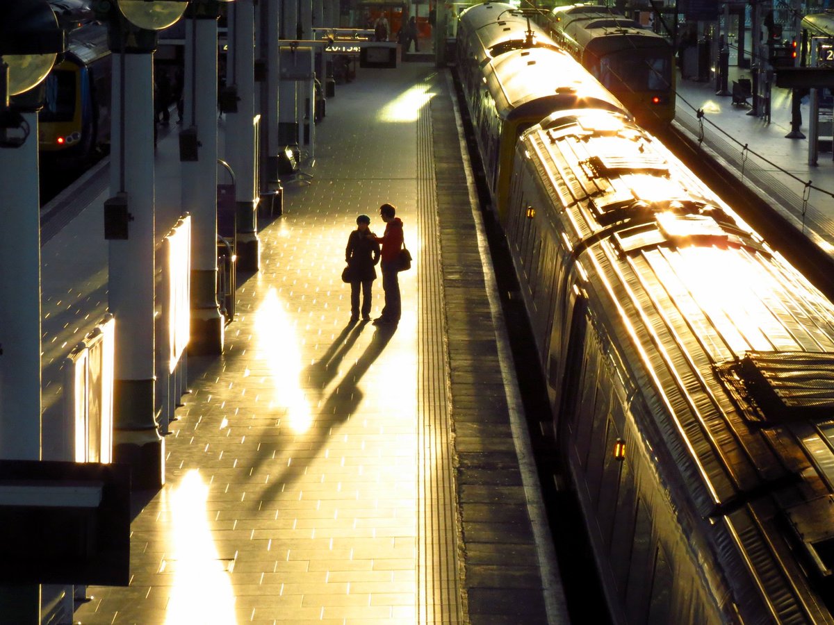 Time to leave, saying goodbye as the sun sinks over Manchester Piccadilly station on 16 May 2012