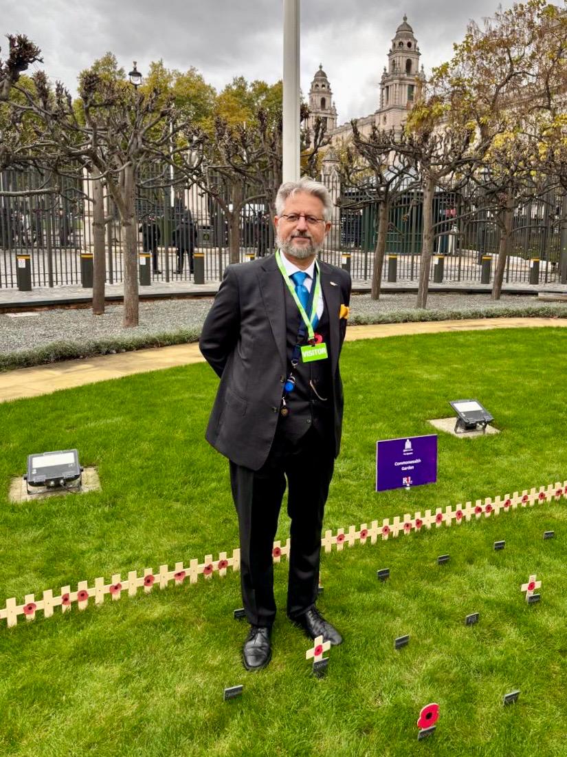 CyprusInUK's tweet photo. At the invitation of @CommonsSpeaker @LindsayHoyle_MP, HC @KourosKyriakos attended the annual opening of the @HouseofCommons #GardensofRemembrance in New Palace Yard, Palace of Westminster, honouring all who served and sacrificed in conflict. 🌺 #LestWeForget #CyprusinUK https://t.co/uSeP1EQDjD