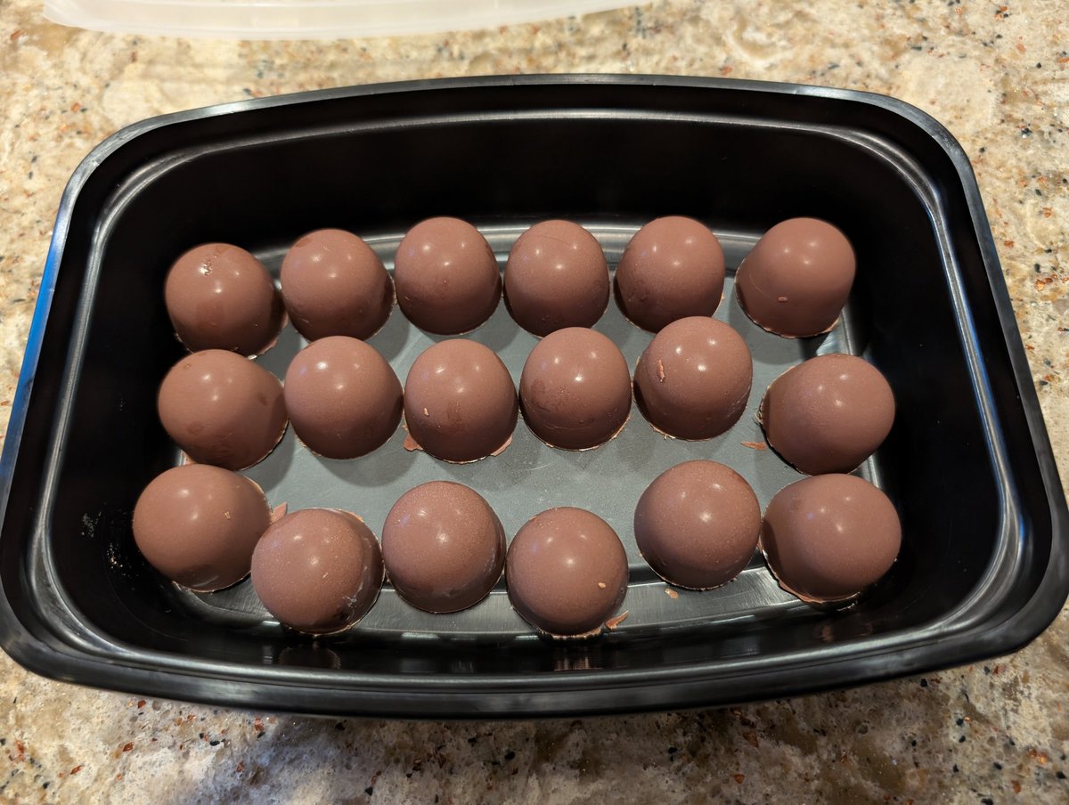 First try at bonbons. Filled with ganache. They're frosted over from being in the freezer. Now I understand why handmade chocolates are so expensive though. 🫠

#chocolate
#foodie