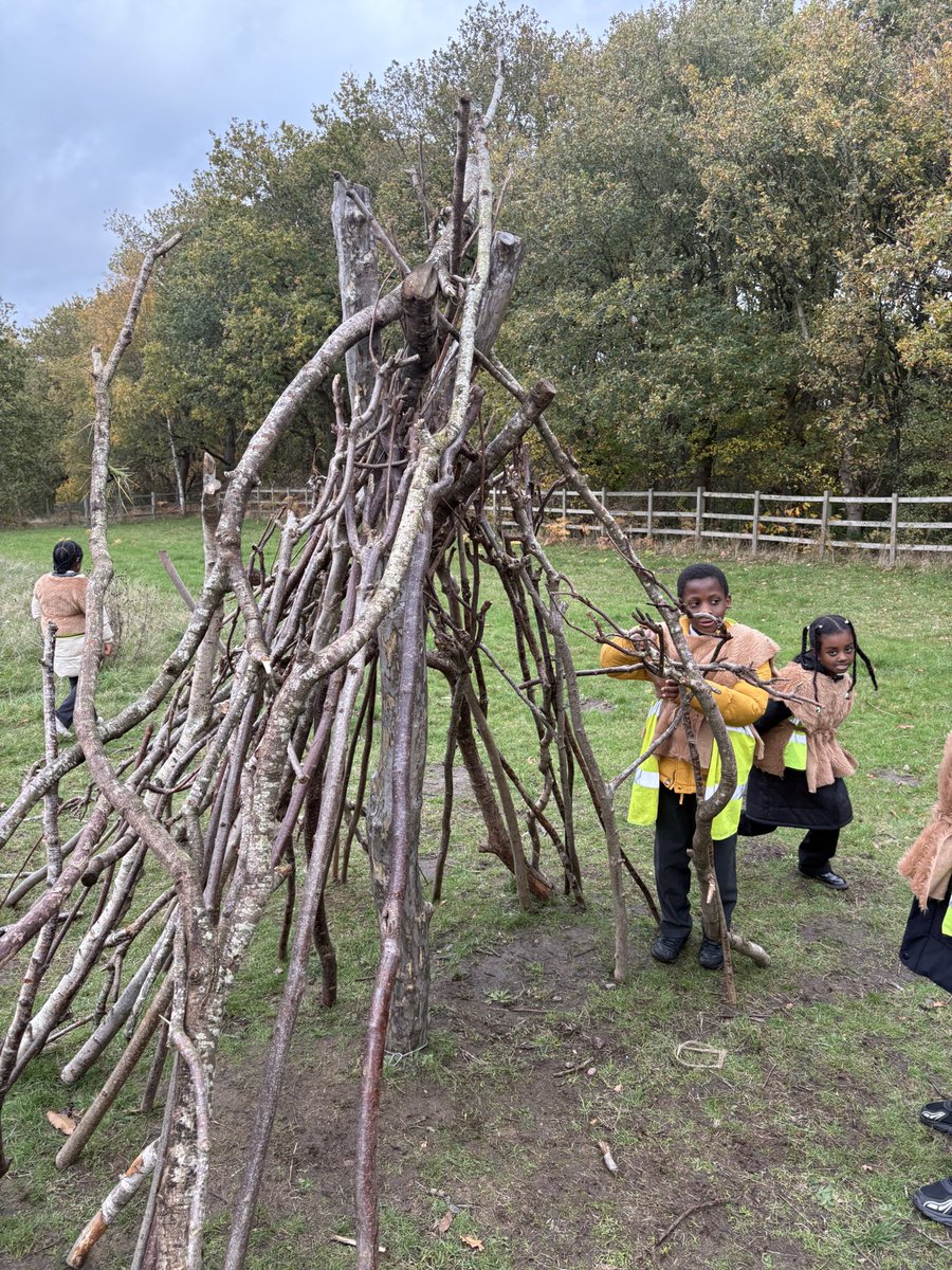 In our tribes (moon, sun and mountain) we made  Stone Age shelters using sticks and animal skins(fake!) <a href="/HazelSchool/">Hazel Community Primary School</a>
