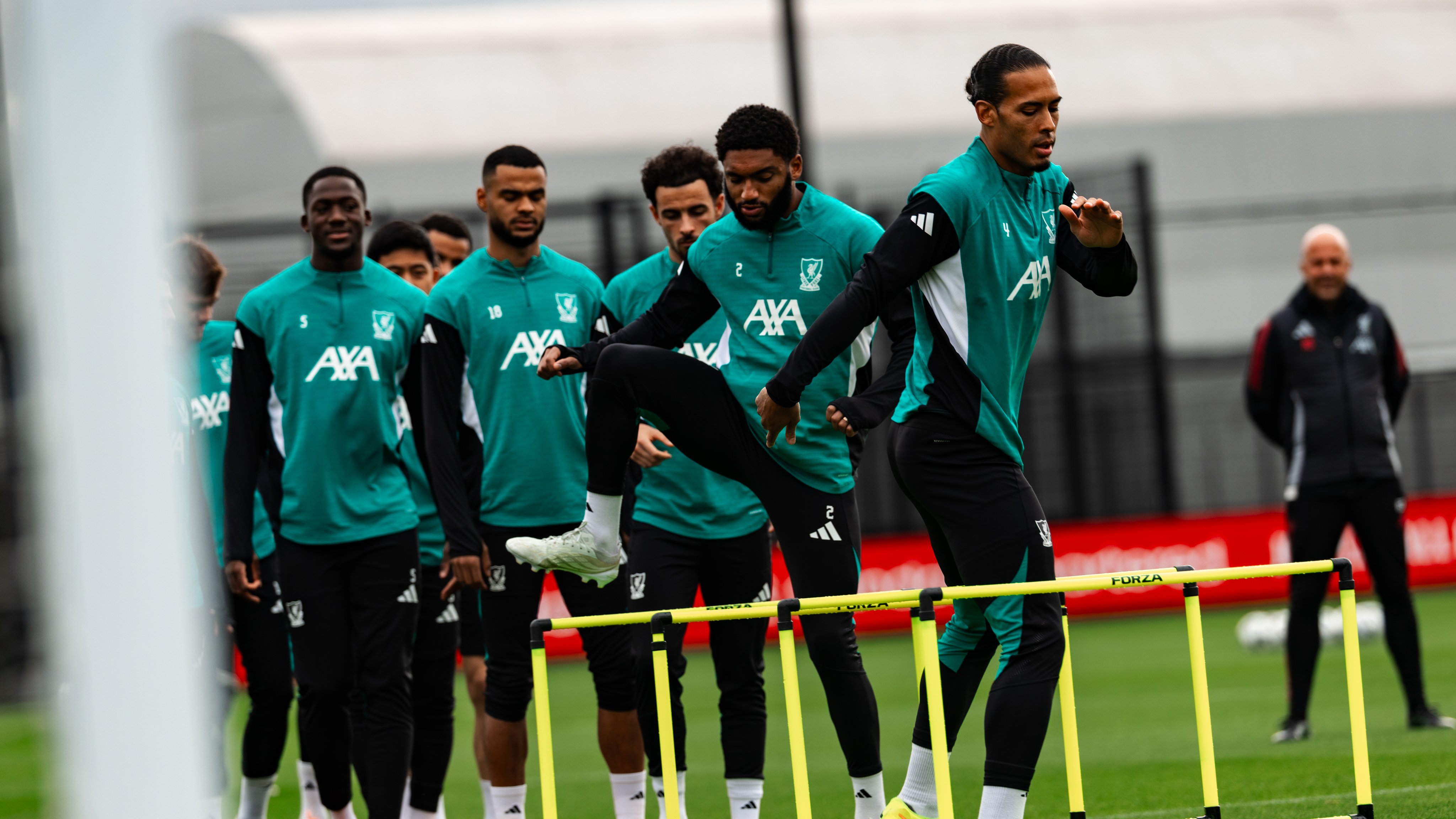 Photography of Liverpool players in training at the AXA Training Centre.
