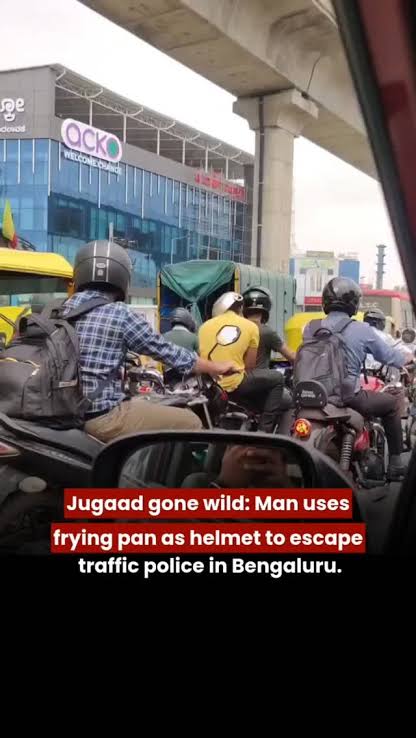 MomentumTrade12's tweet image. In a truly “peak Bengaluru” moment, a pillion rider was caught wearing a frying pan on his head instead of a helmet to dodge a traffic fine—another reminder that road safety isn’t optional. 🚨 #Bengaluru #RoadSafety #ThinkSmart #HelmetPlease