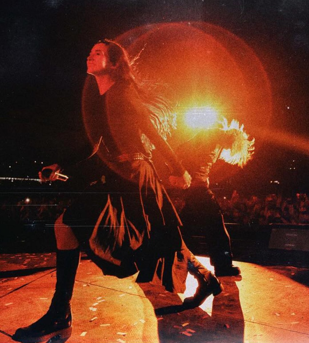 Poppy and Emily Armstrong (Linkin Park) glow on stage together.