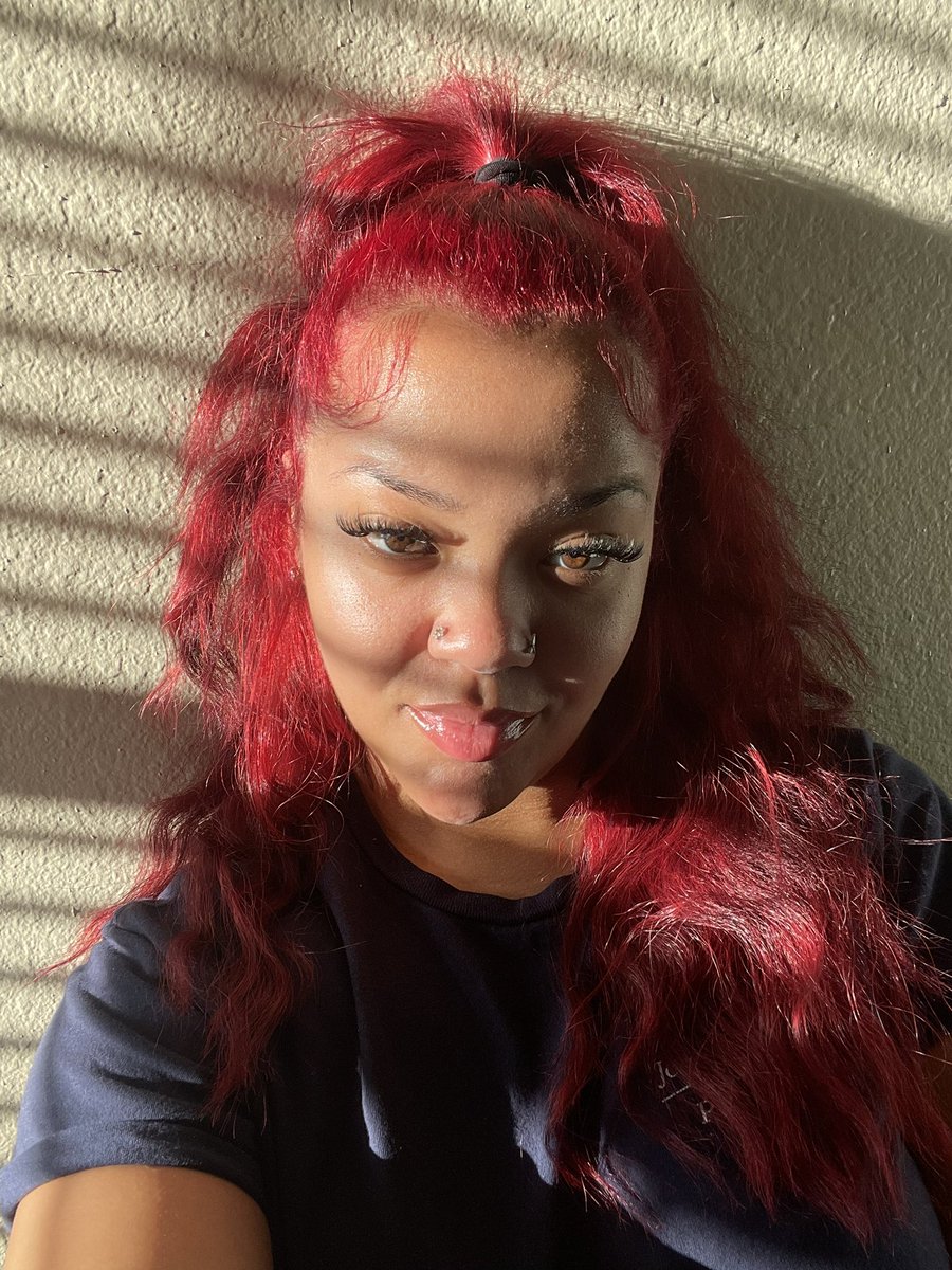 At work taking pictures by the window cause I thought my hair looked pretty in the sun.