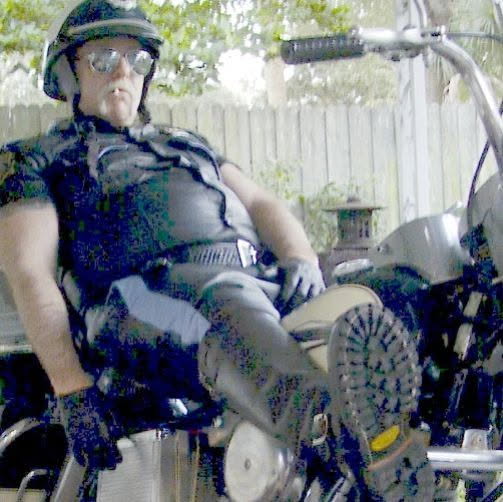 BULL COP relaxes on his  motorcycle  look at them BOOT  SOLES