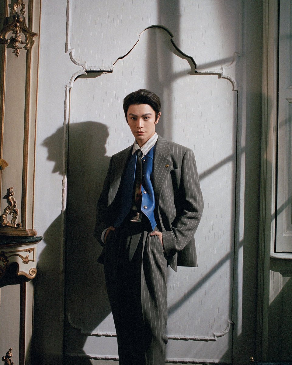 dingyuxip's tweet photo. In the play of light and shadow, sophistication takes form. The suit, the gaze, the stance — all parts of a quiet rebellion against the ordinary. He doesn’t follow style. He defines it. https://t.co/GEzShGS8XC