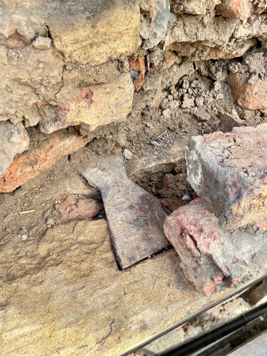 Here's a remarkable detail from the west side of the main roof, where an oak beam is dovetailed into the stone wall. We were all quite impressed to think that no one has seen this tidy if truly odd piece of work since this part of the building was finished in 1690.